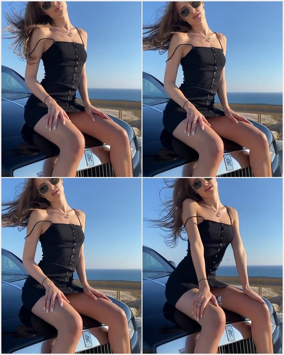 Viktoria Tishko with sexy legs on the car. Download free video.